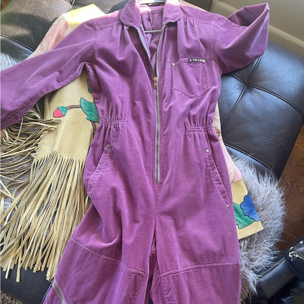 g. Pellini Corduroy jumpsuit with sinched waist and zippers.